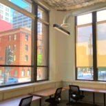 room with a lot of windows and desks at the west loop location