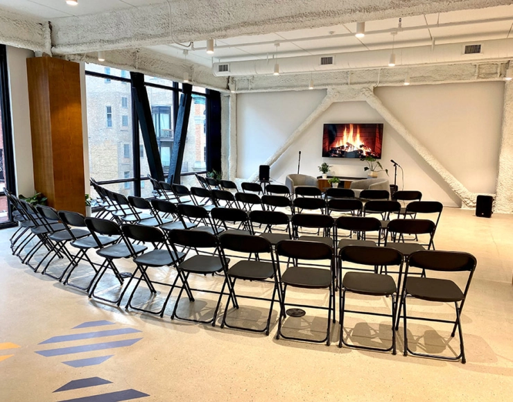 event space showing large number of chairs and protector