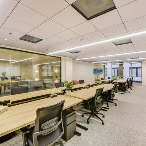 wide view of a downtown office featuring desks and chairs