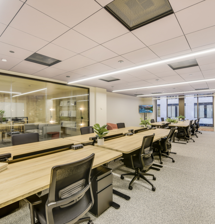 wide view of a downtown office featuring desks and chairs