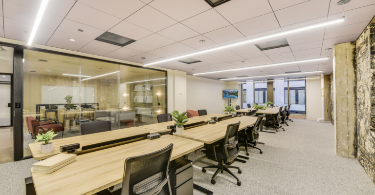wide view of a downtown office featuring desks and chairs