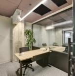 office cubicle with a desk and chair in the workbox down town