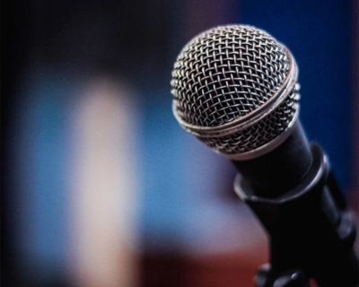 close up of a microphone with a blurry background
