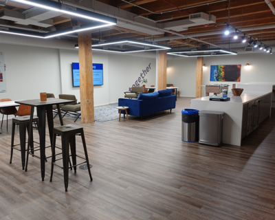 wide view showing table chairs of a magnificent mile office