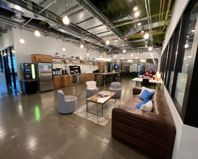 wide-view showing pantry and table chairs of a gold coast office