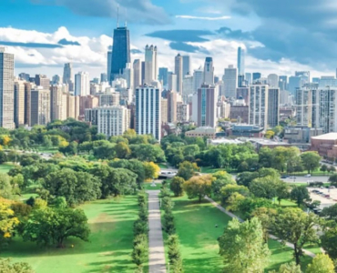 aerial shot of a garden with a pathway, with a skyline view of downtown chicago in the distance