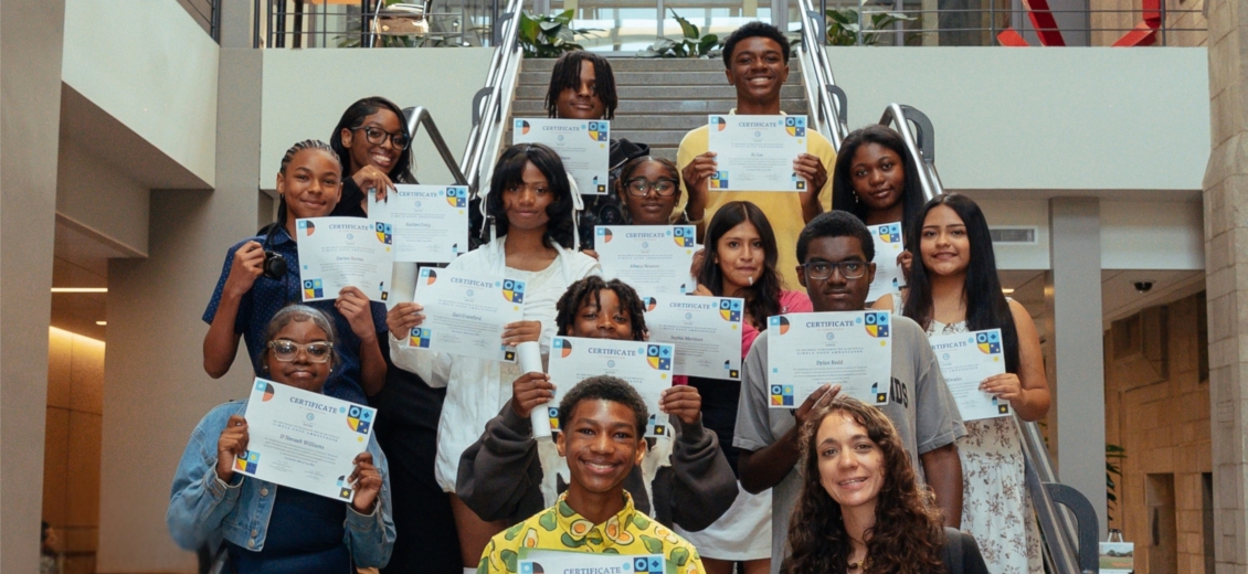 Proud group of children displaying their certificates