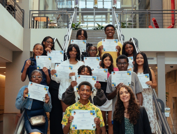 Proud group of children displaying their certificates