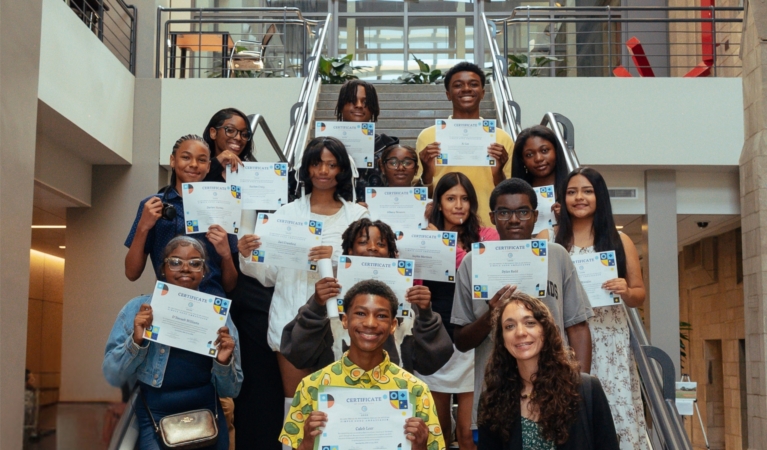 Proud group of children displaying their certificates